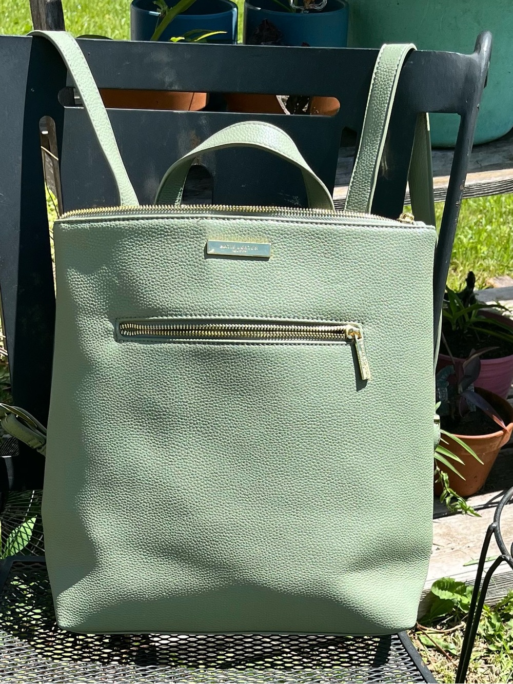 Mint Green Pebbled Leather Backpack with Gold Accents